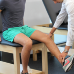 Physical therapist performs running analysis.